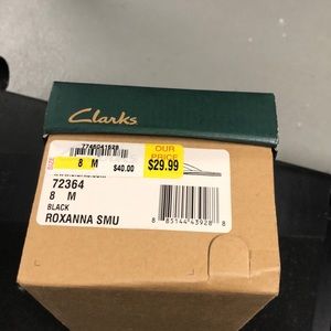 Clark’s black leather flip flops